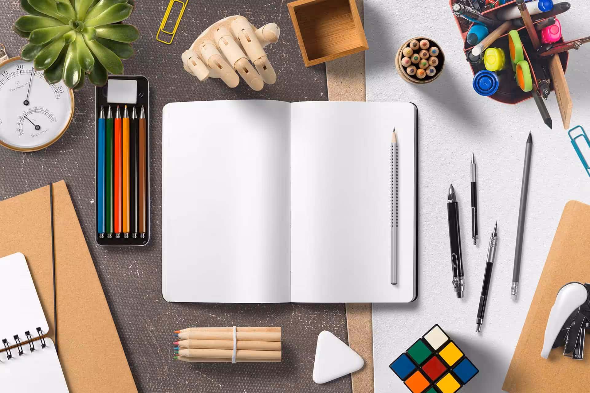 Colorful stationery and office supplies on a workspace for creative and professional design projects.