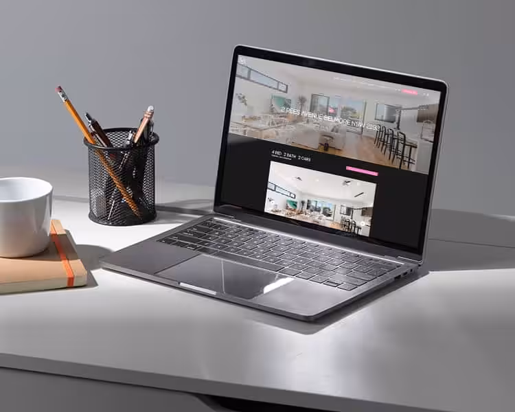 Modern laptop displaying web design for Sydney Web Experts.